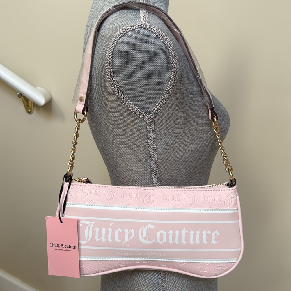 Juicy Couture Pink Shoulder Bag. Juice Couture on front.  Handle is part chain.